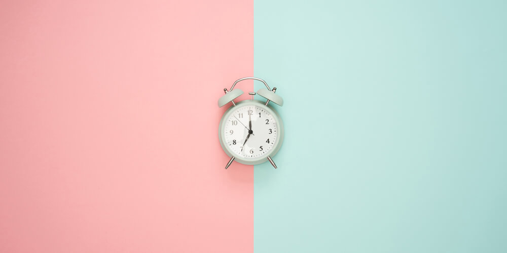 picture of alarmclock. colorful background behind