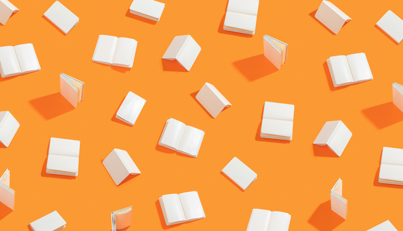 Books on orange background